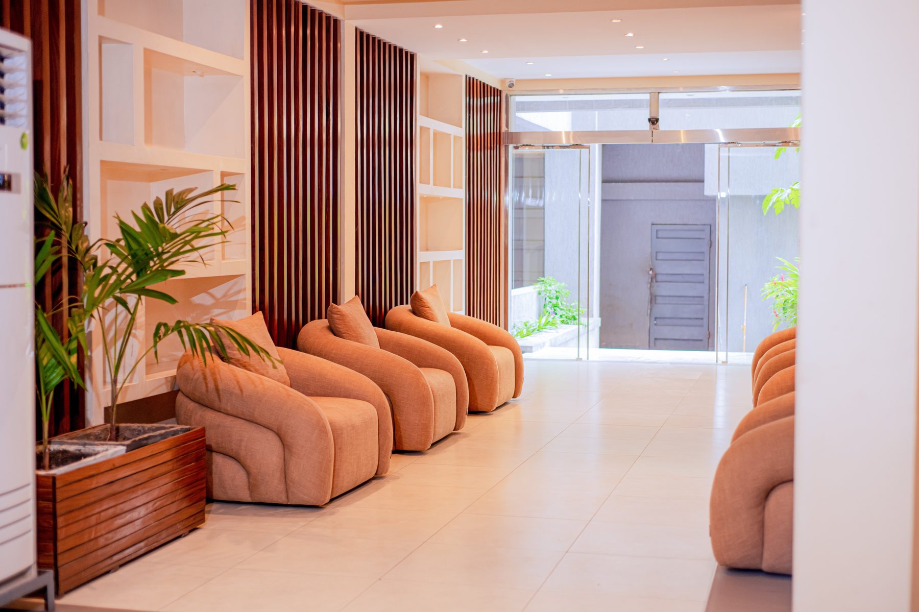 OBSIM Residence lobby with bouclé lounge chairs